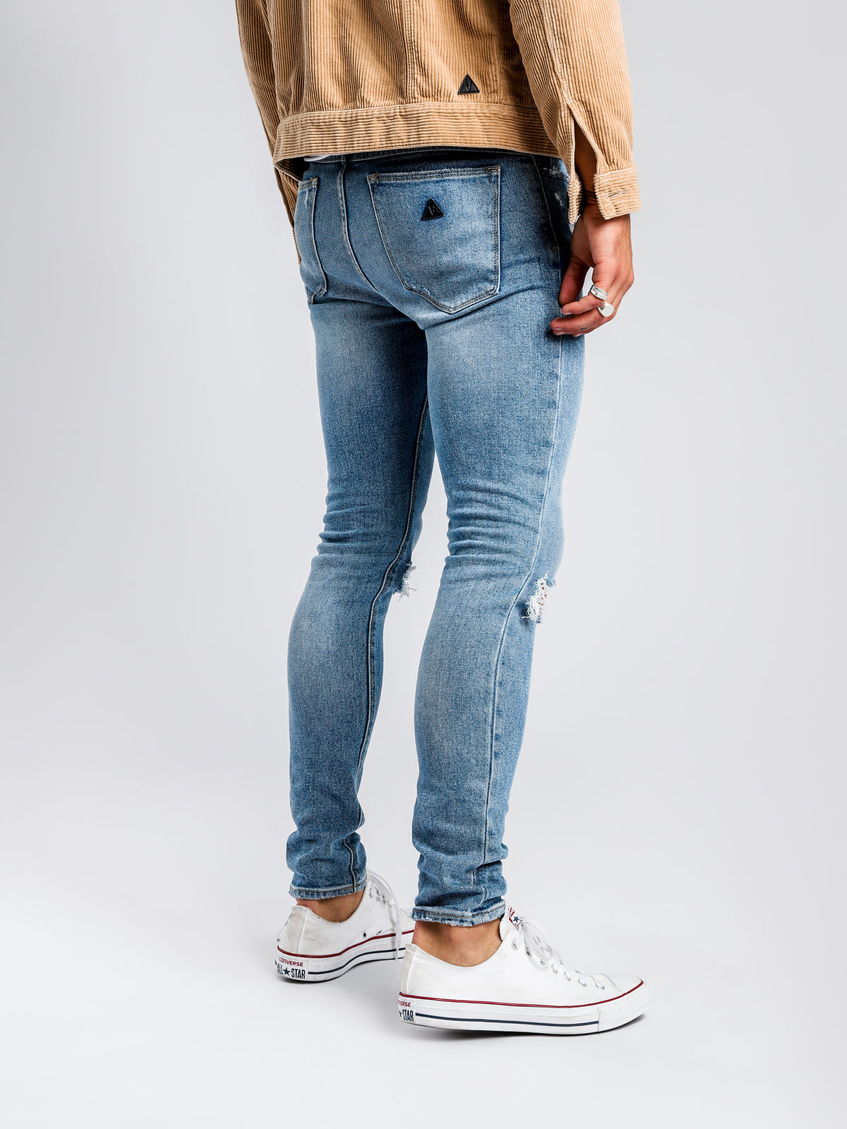 A Dropped Skinny Turn Up Jean in Scuzz Blues Denim