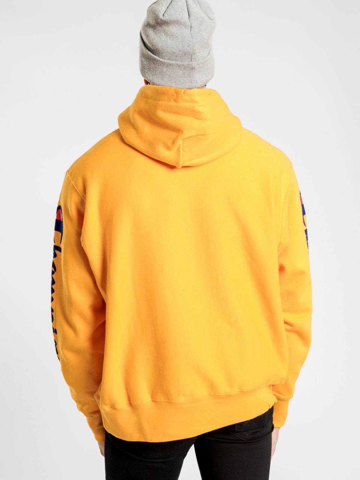 Reverse Weave Script Hooded Pullover in Gold