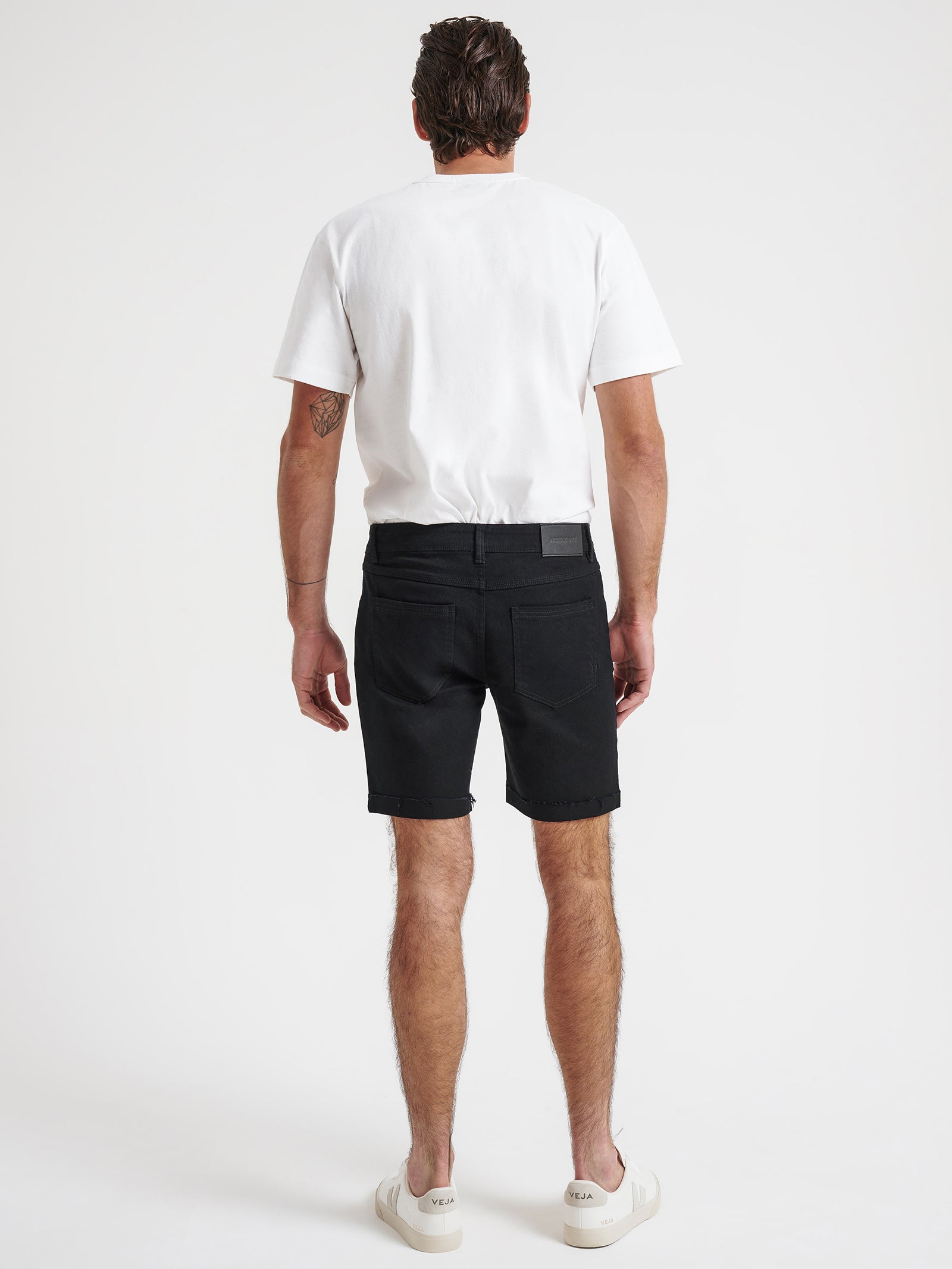Zane Skinny Denim Shorts in True Black Rip