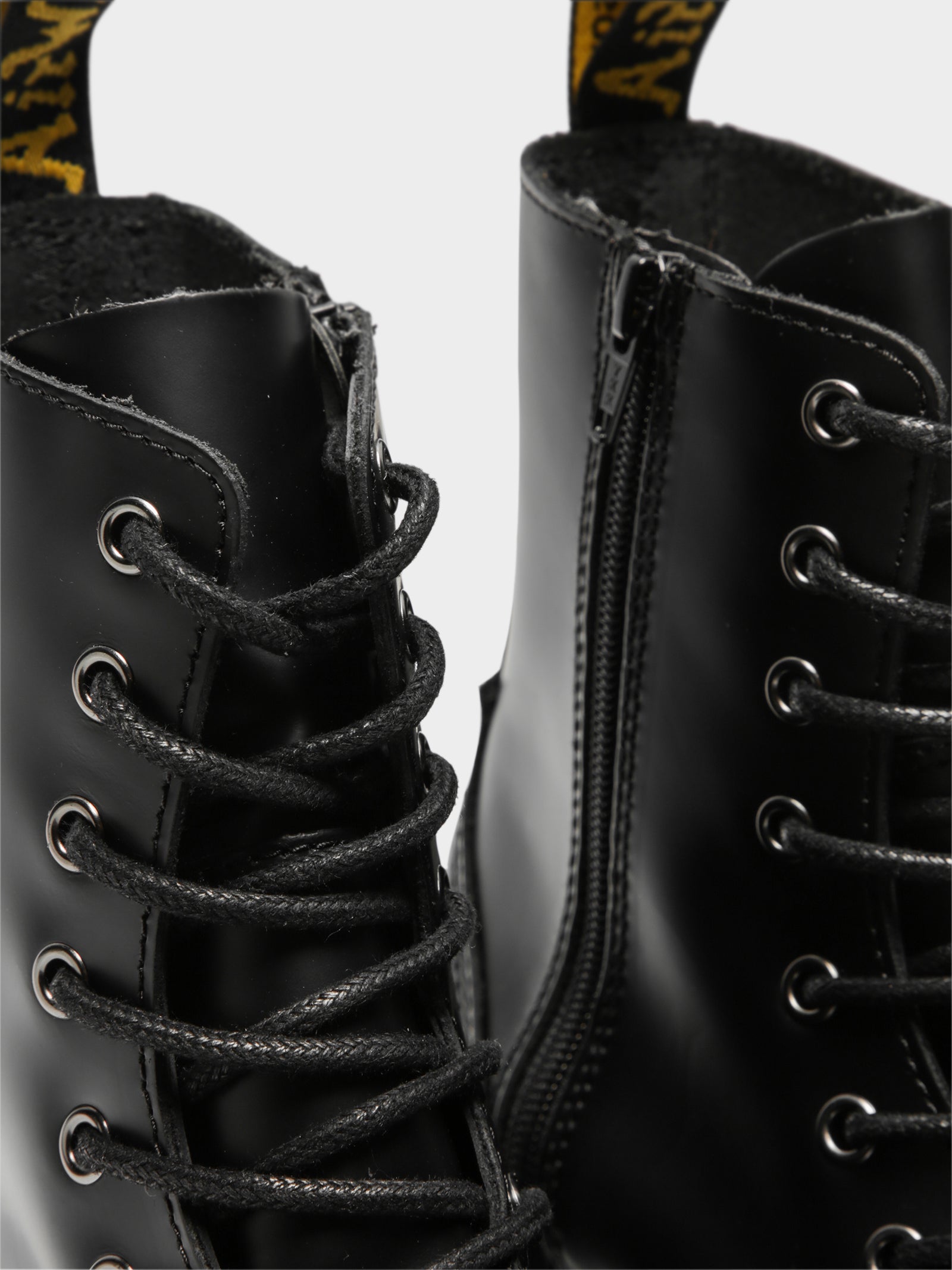 Unisex Jadon 8 Eyelet Lace Up Platform Boots in Black Leather