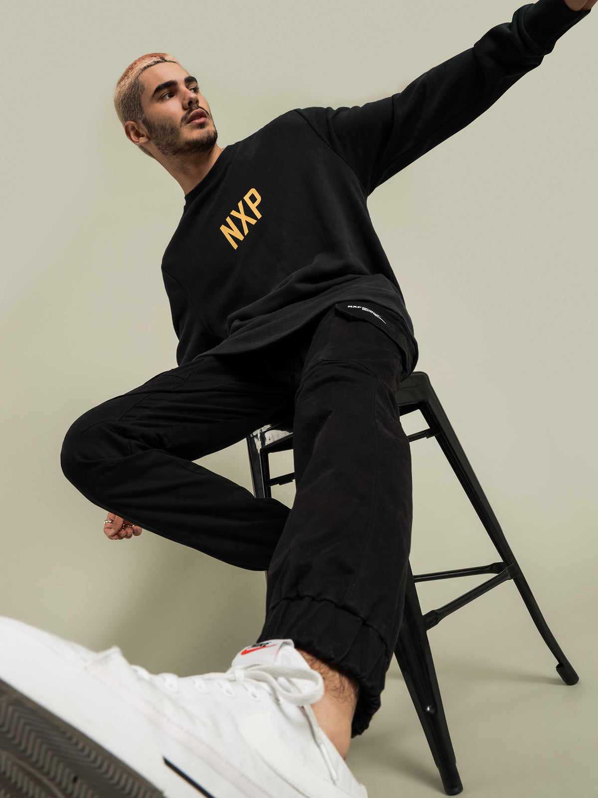 Nena and Pasadena Unfaithful Dual Curved Hem Sweater | Black
