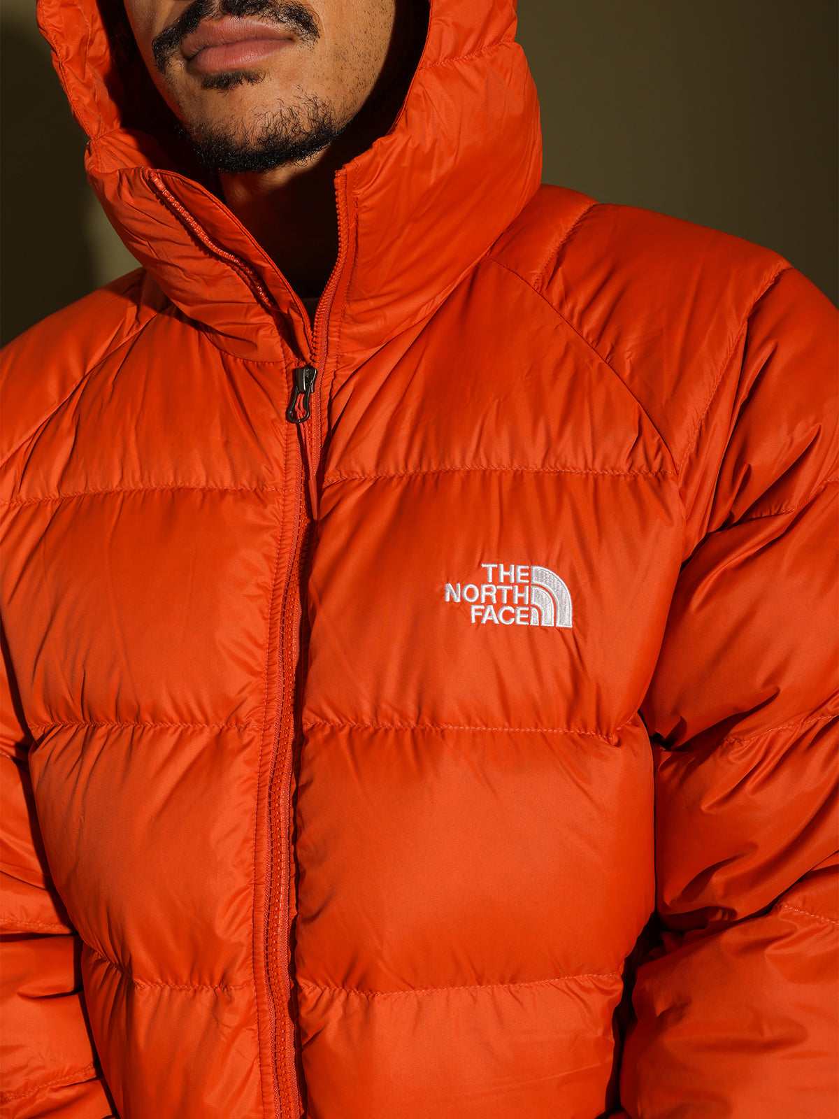 Hyalite Down Hooded Jacket in Burnt Ochre Orange