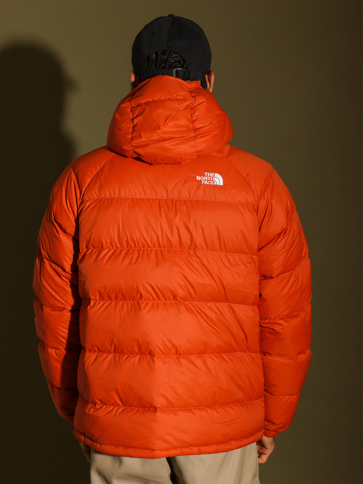 Hyalite Down Hooded Jacket in Burnt Ochre Orange