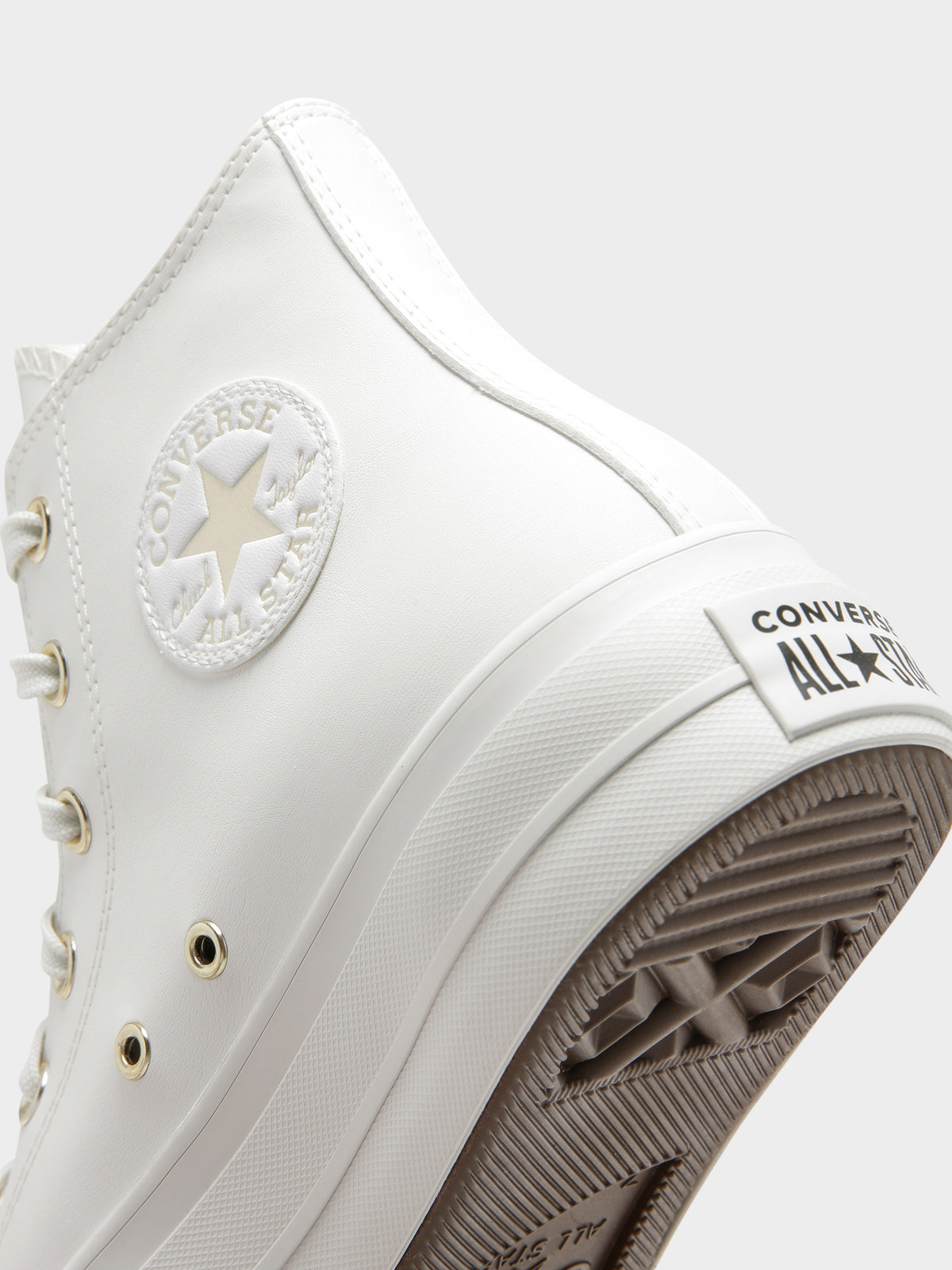 Womens Chuck Taylor Synthetic Leather Lift High Tops in Vintage White