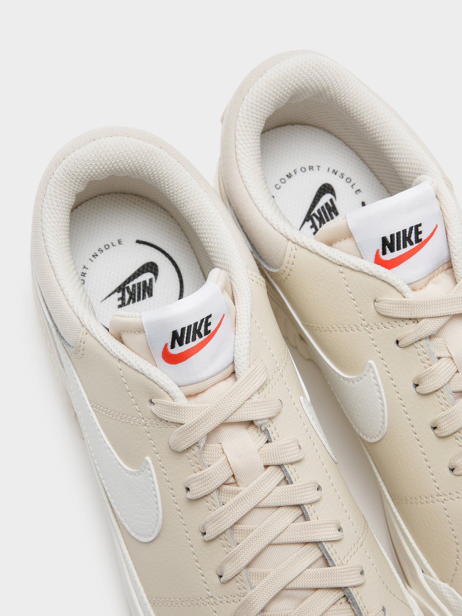 cream nike sneakers