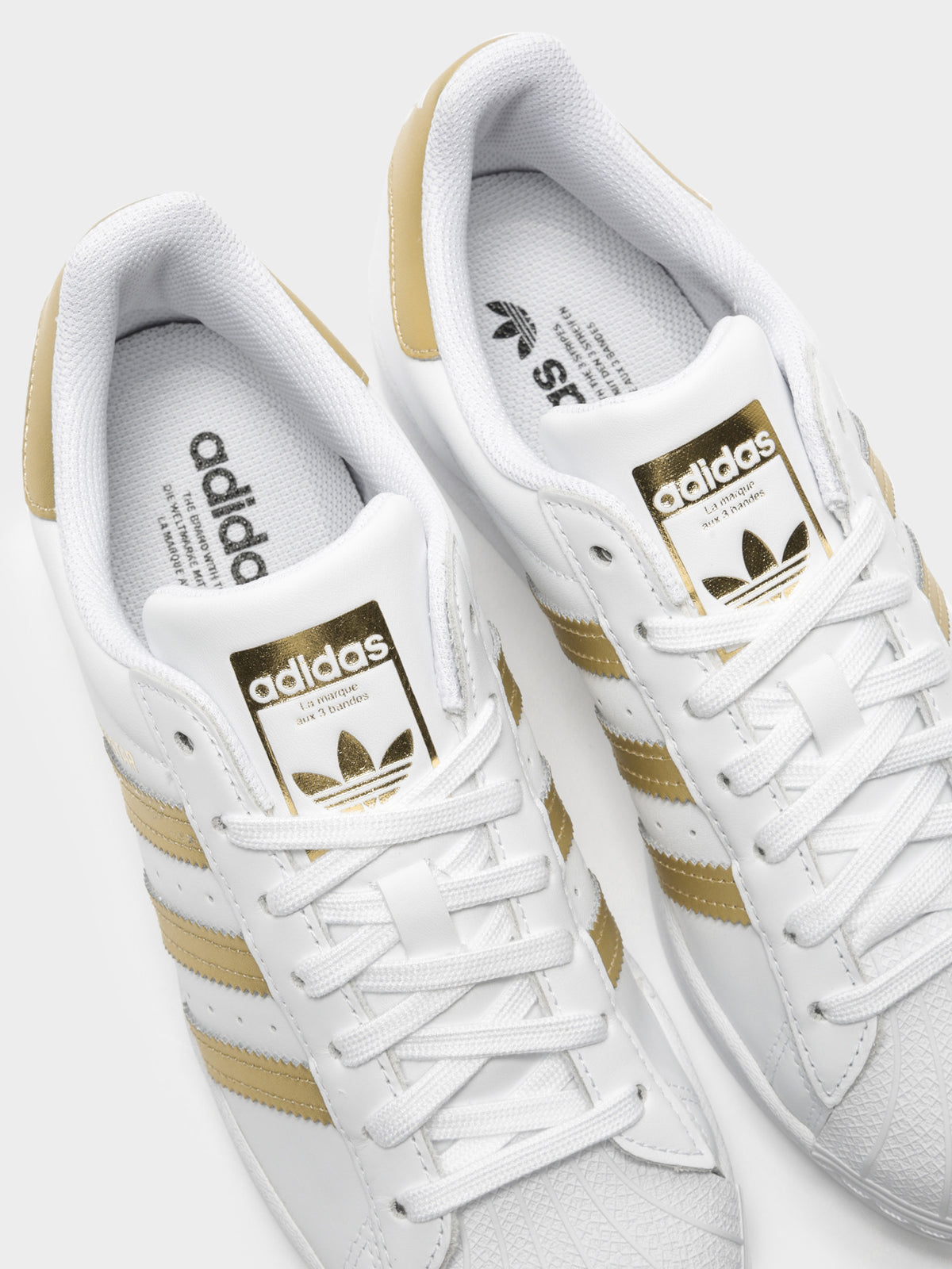 Womens Superstar Sneakers in White &amp; Gold